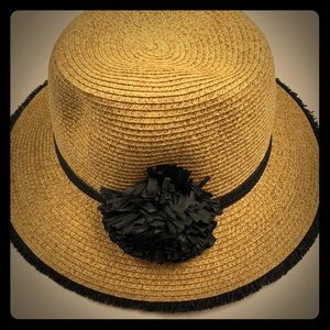 Straw hat with black Pom Pom and black trim